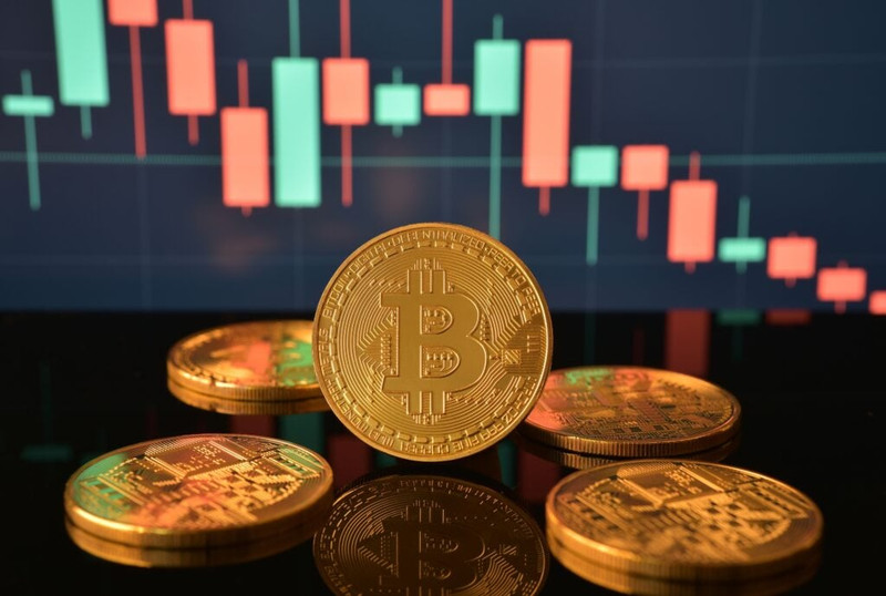 Bitcoin-Coins-On-Reflective-Black-Surfac.jpeg