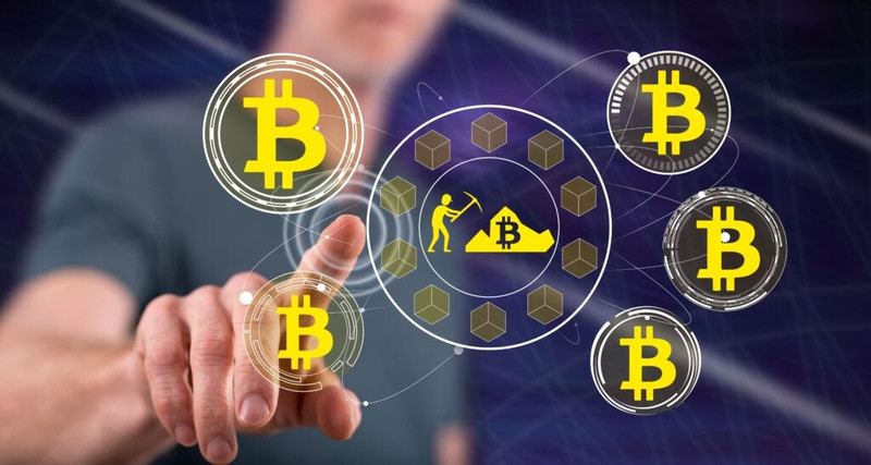 Man-Touching-A-Bitcoin-Mining-Concept-On.jpeg